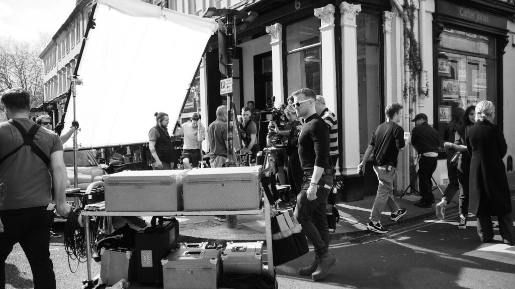 A film crew works on a professional production set during a television or movie shoot.