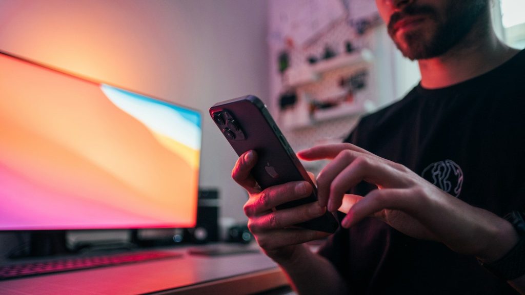 Person watching a viral video on a smartphone.