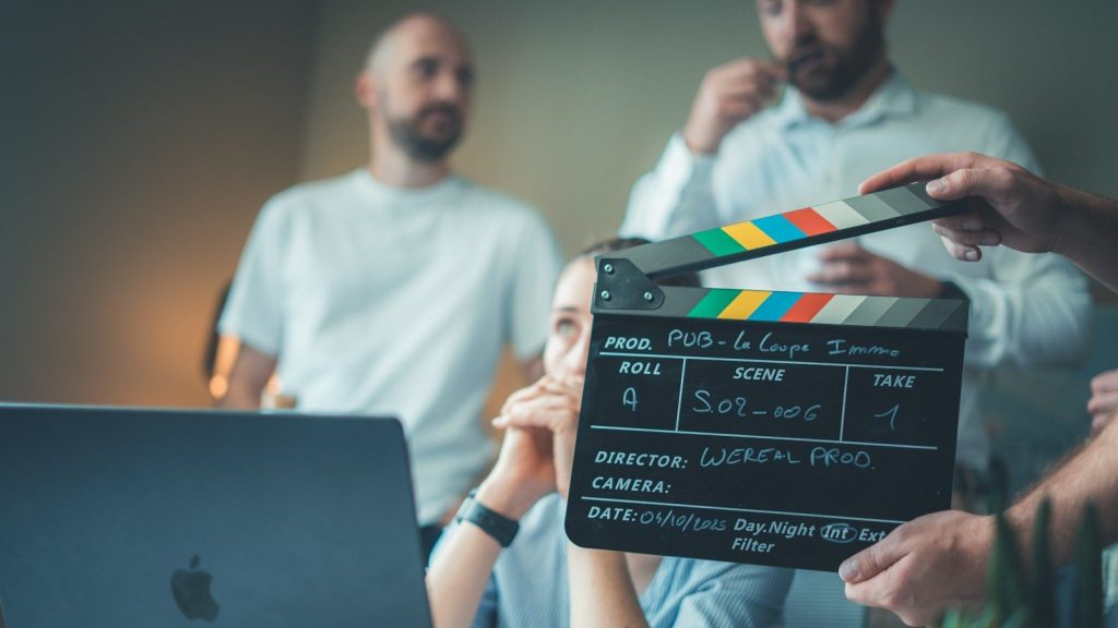 Film clapperboard during a production meeting.