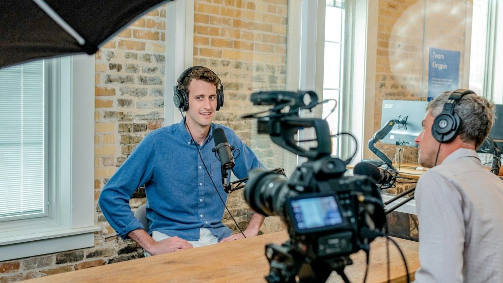 Journalist interviewing a guest during a television interview