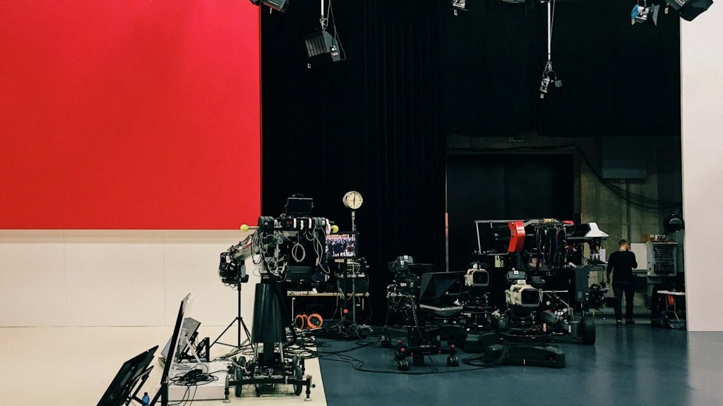 Empty television studio with production equipment.
